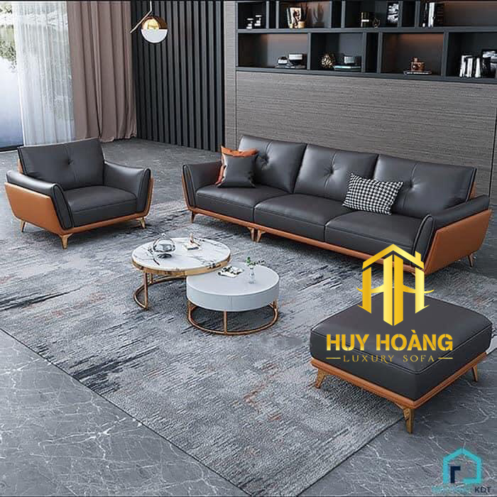 Sofa văng da bò phối màu đen và cam, thiết kế hiện đại, sản phẩm của xưởng Sofa Huy Hoàng tại Hà Nội.